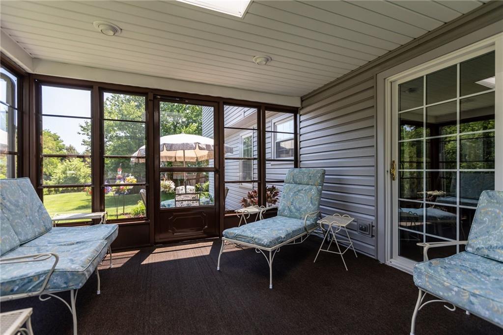 136 Lakeview Drive McKees Rocks, PA 15136 - Photo 13 of 24 a living room with furniture a table and a large window