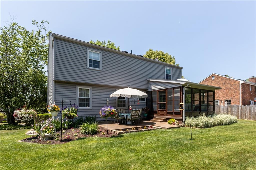 136 Lakeview Drive McKees Rocks, PA 15136 - Photo 14 of 24 a front view of a house with a garden and porch