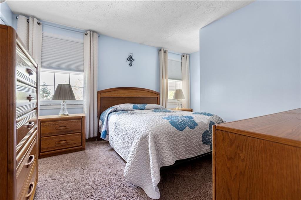 136 Lakeview Drive McKees Rocks, PA 15136 - Photo 18 of 24 a bedroom with a bed and window