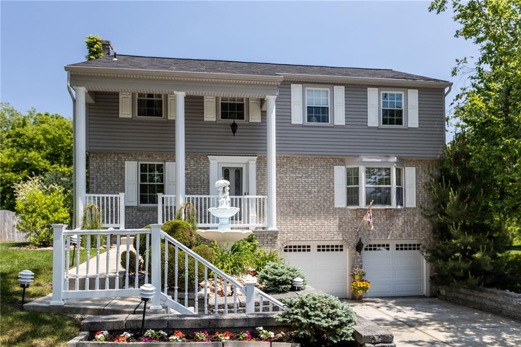 136 Lakeview Drive McKees Rocks, PA 15136 - Photo 2 of 24 a front view of house with street