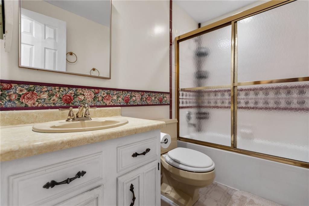 136 Lakeview Drive McKees Rocks, PA 15136 - Photo 21 of 24 a bathroom with a sink a toilet and mirror
