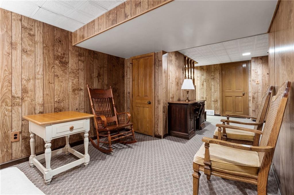 136 Lakeview Drive McKees Rocks, PA 15136 - Photo 22 of 24 a room with a table chairs and mirrors