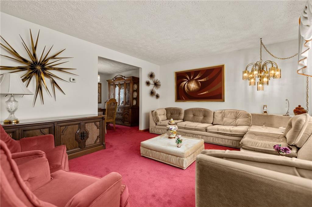 136 Lakeview Drive McKees Rocks, PA 15136 - Photo 3 of 24 a living room with furniture and a flat screen tv