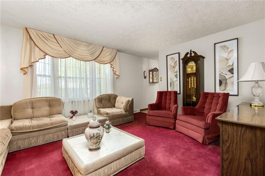 136 Lakeview Drive McKees Rocks, PA 15136 - Photo 4 of 24 a living room with furniture and a window