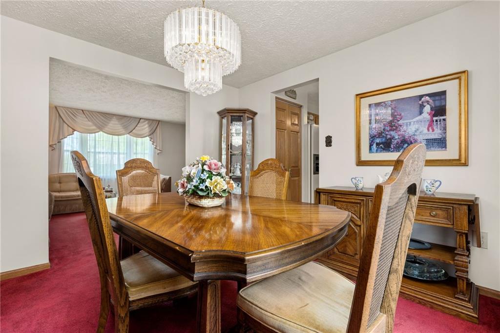 136 Lakeview Drive McKees Rocks, PA 15136 - Photo 6 of 24 a view of a dining room with furniture and chandelier