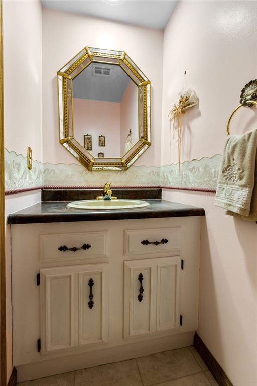 136 Lakeview Drive McKees Rocks, PA 15136 - Photo 9 of 24 a bathroom with a sink and a mirror