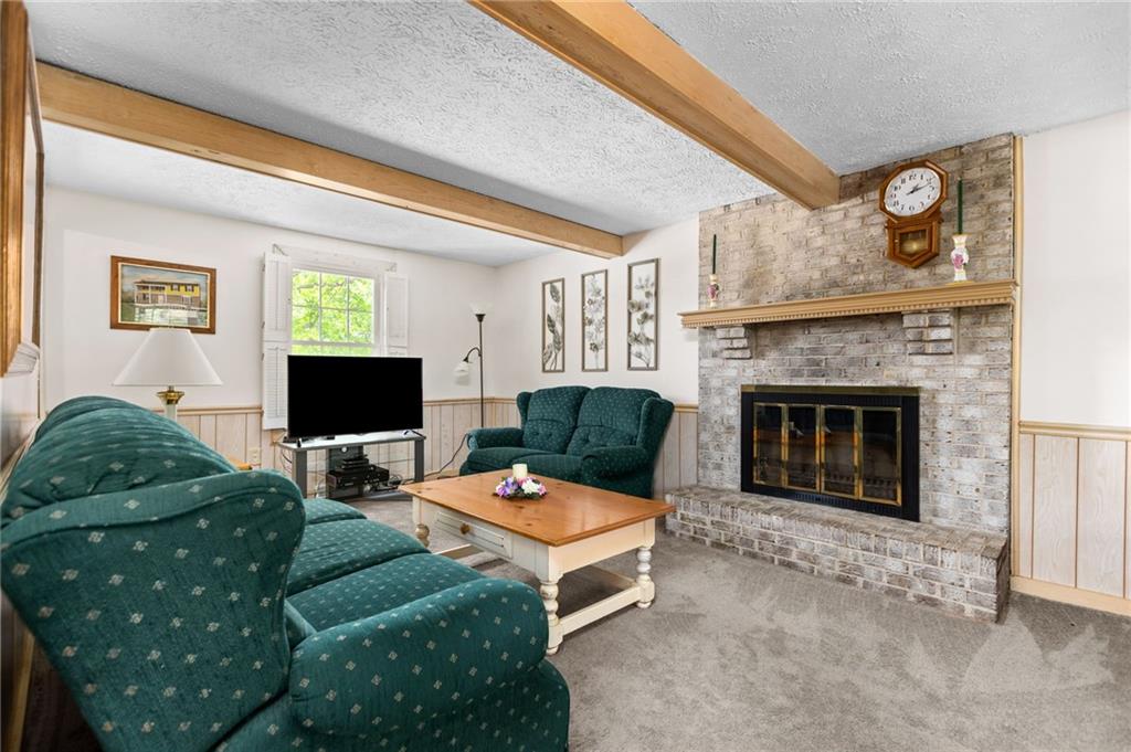 136 Lakeview Drive McKees Rocks, PA 15136 - Photo 10 of 24 a living room with furniture and a fireplace
