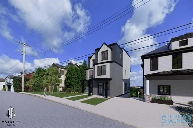a view of a brick building next to a yard