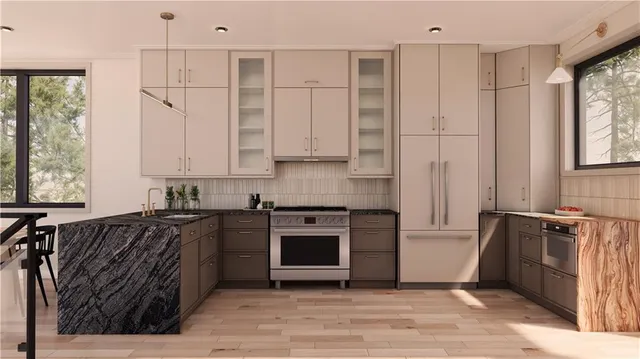 a kitchen with stainless steel appliances granite countertop a stove a sink and a refrigerator