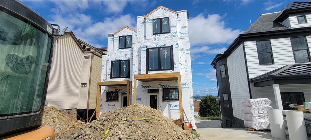 132 Prospect Street Mount Washington, PA 15211 - Photo 5 of 19 a view of a brick house with a large windows