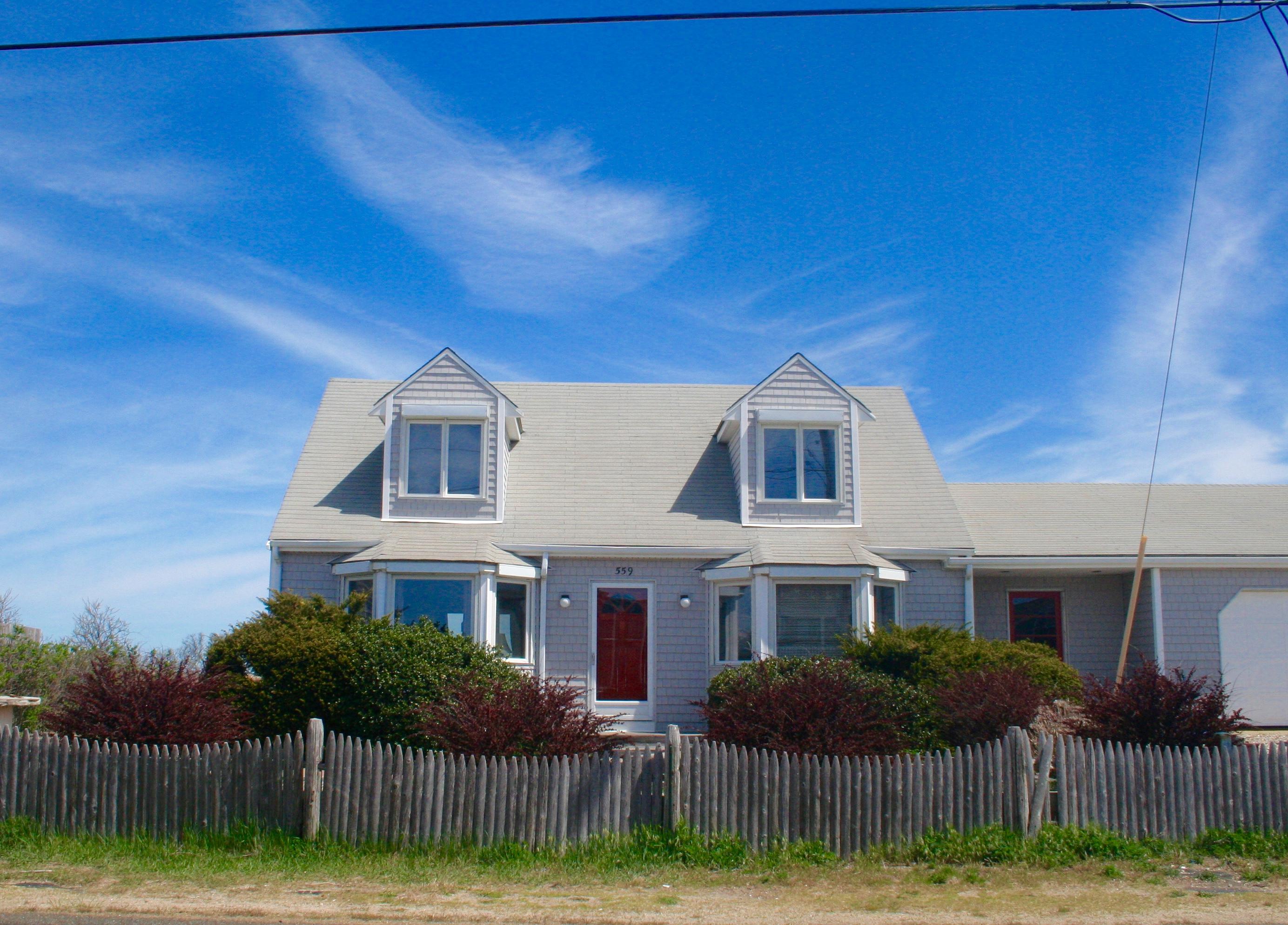 559 Shore Road Truro, MA 02666 - Photo 2 of 9 a front view of house with yard and green space