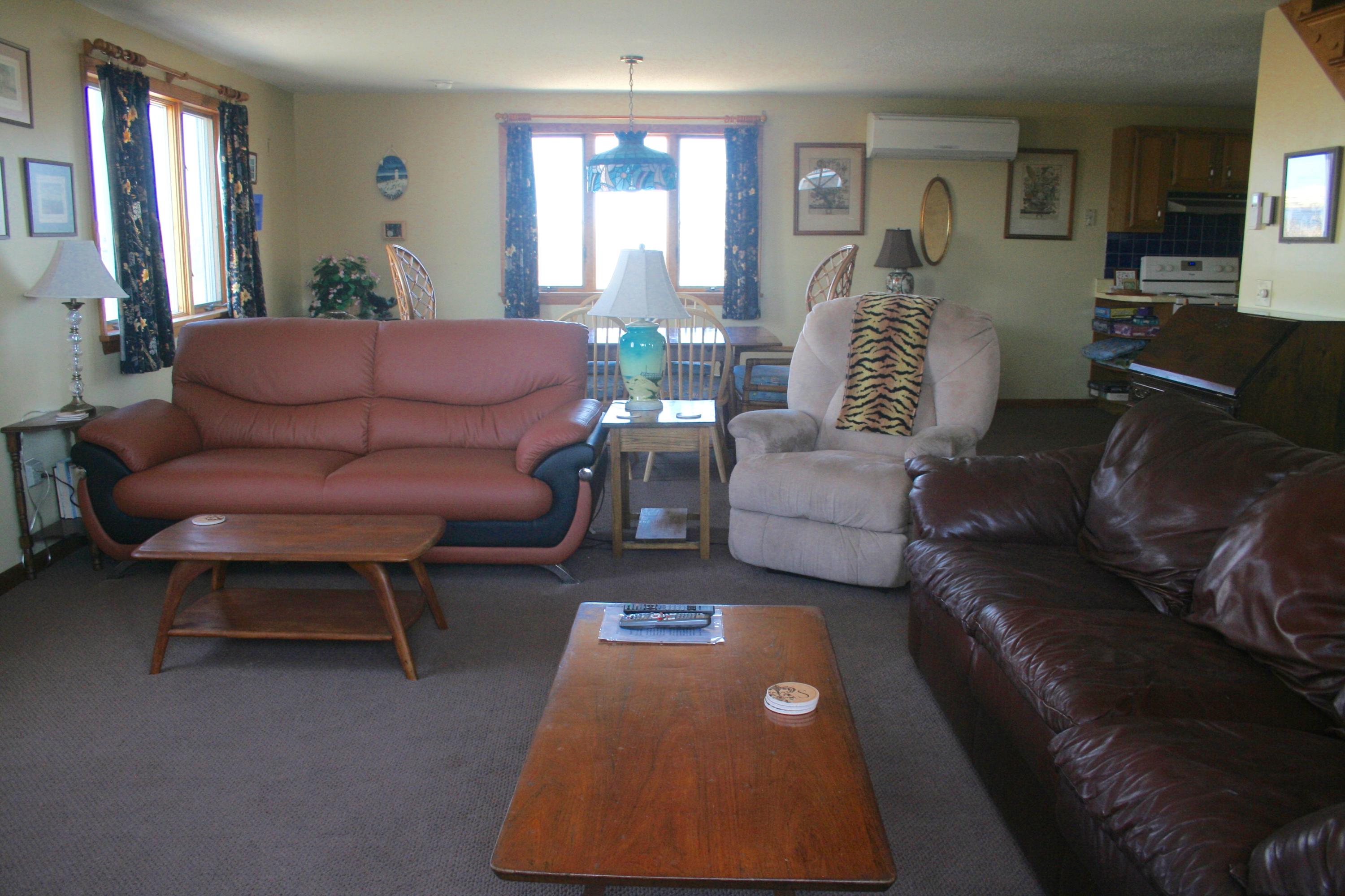 559 Shore Road Truro, MA 02666 - Photo 6 of 9 a living room with furniture and a rug