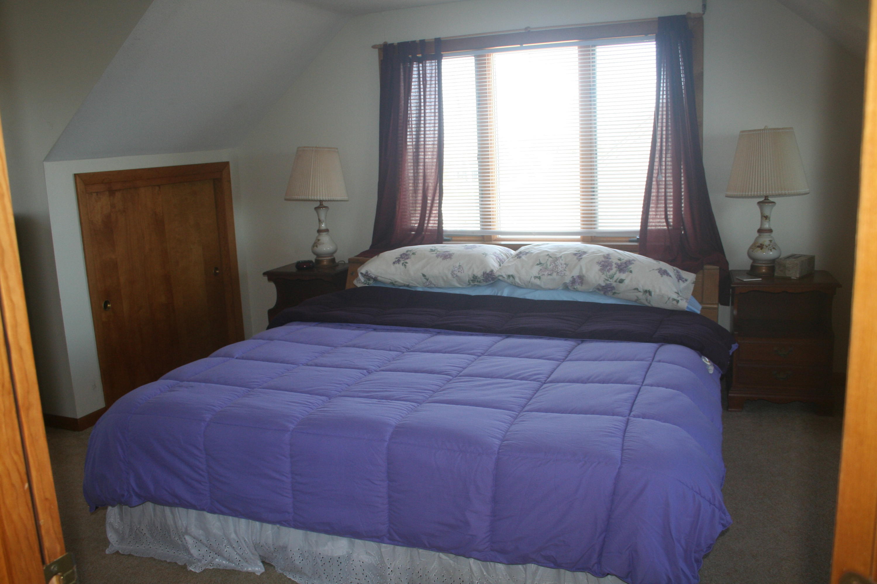 559 Shore Road Truro, MA 02666 - Photo 8 of 9 a bedroom with a bed and window