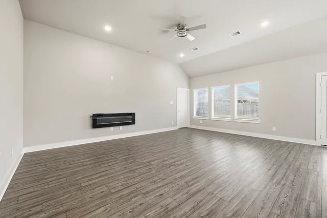 a view of an empty room with glass door
