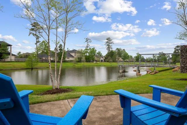 a view of a lake with a garden and trees