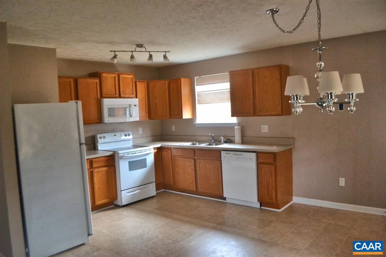 252 Rochelle School Lane Rochelle, VA 22738 - Photo 3 of 17 a kitchen with stainless steel appliances granite countertop a sink a stove a refrigerator cabinets and a window
