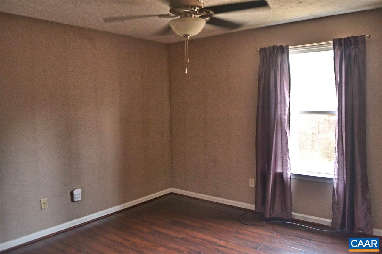 252 Rochelle School Lane Rochelle, VA 22738 - Photo 8 of 17 an empty room with wooden floor and windows