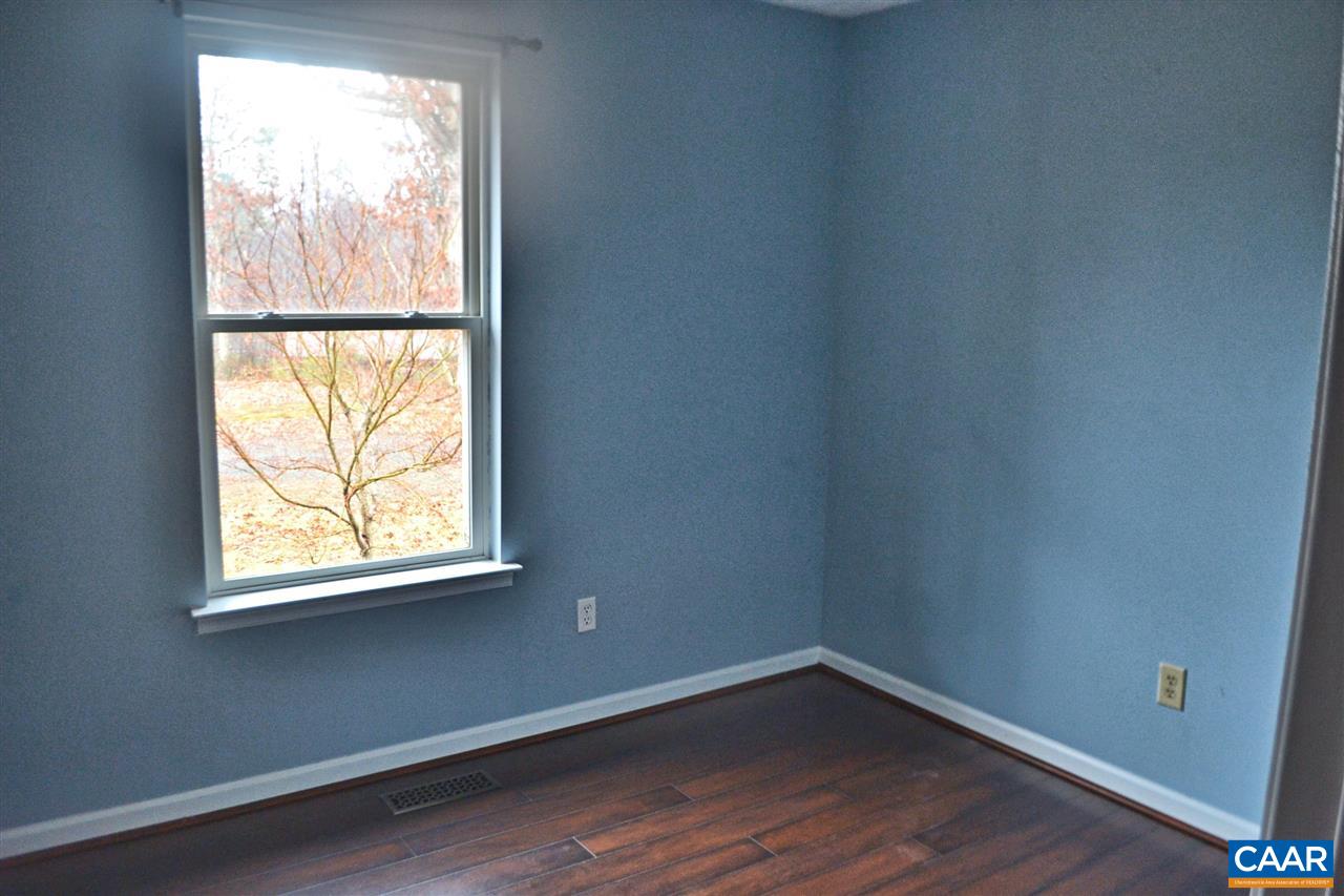 252 Rochelle School Lane Rochelle, VA 22738 - Photo 10 of 17 an empty room with wooden floor and windows