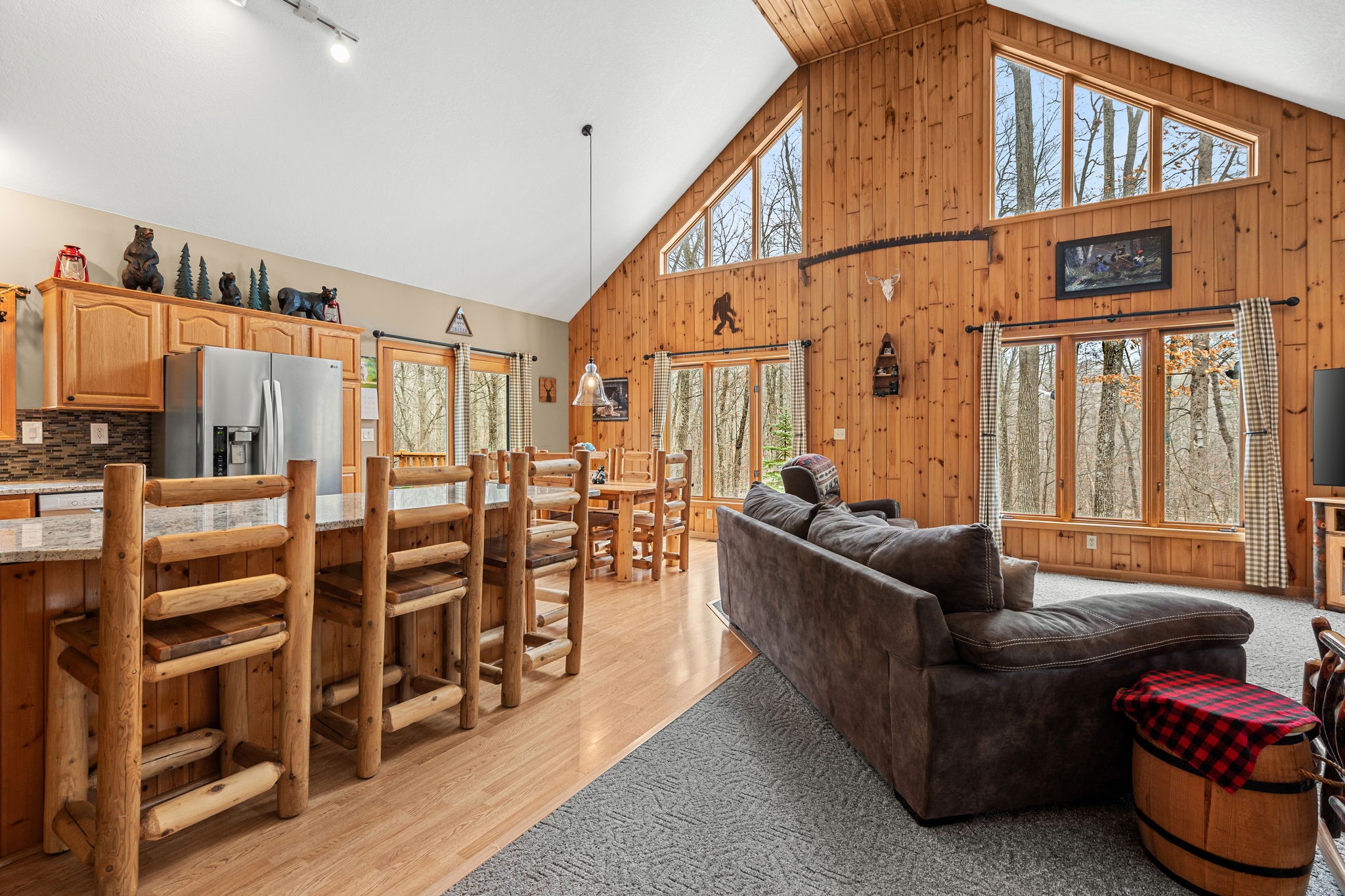 1388 West Town Hall Road Springbrook, WI 54875 - Photo 11 of 55 Floor to ceiling windows brings an abundance of natural light to the kitchen and dining area.