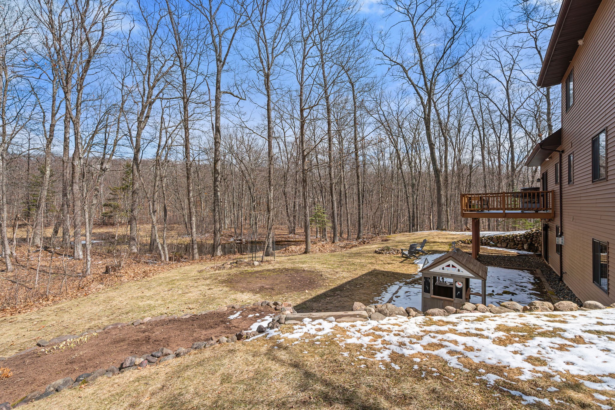 1388 West Town Hall Road Springbrook, WI 54875 - Photo 39 of 55 Backyard overlooks the woods and pond, great for hunting or enjoying wildlife.