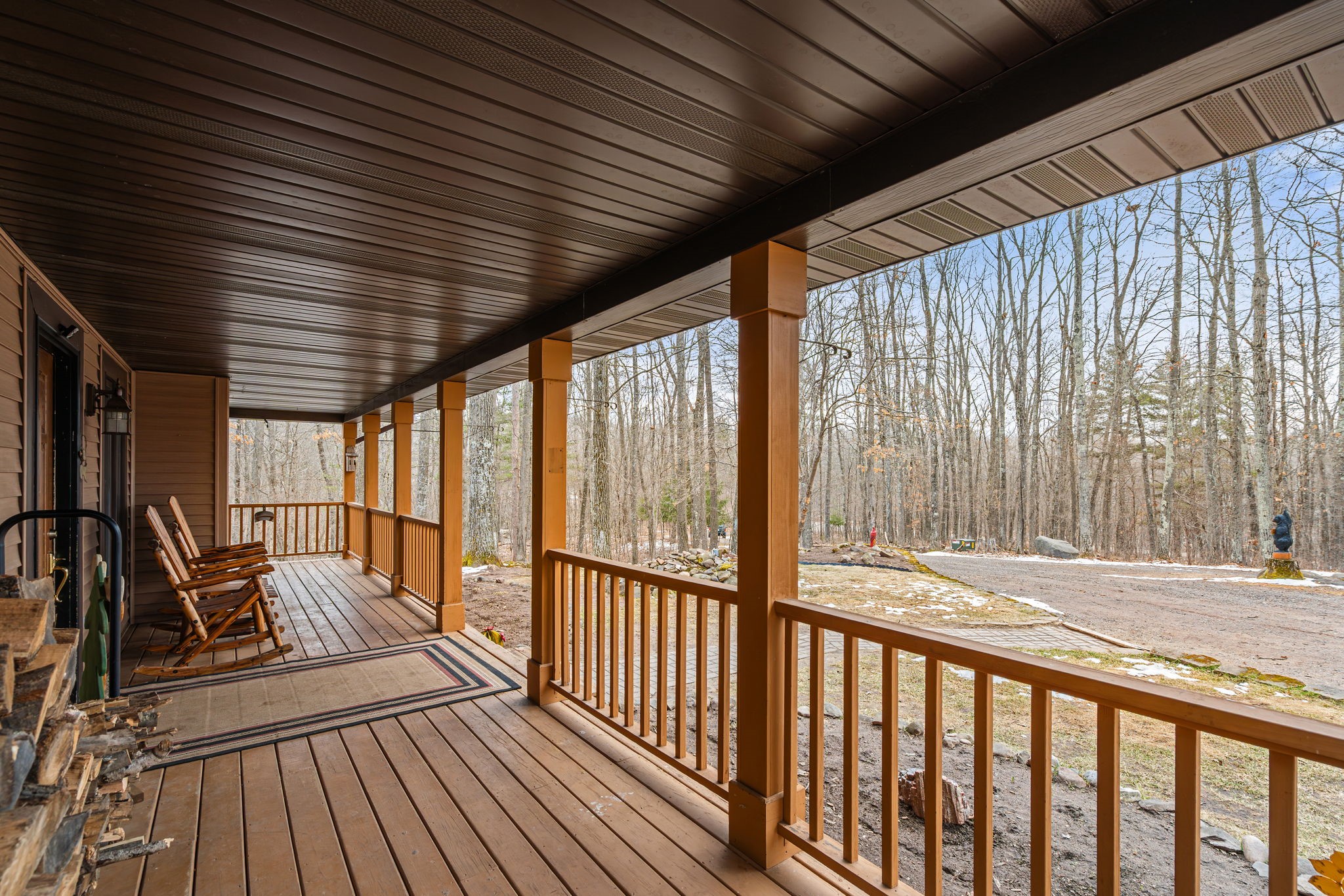 1388 West Town Hall Road Springbrook, WI 54875 - Photo 6 of 55 Stay dry and comfortable under this covered porch while listening to the birds.