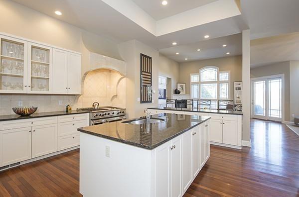 100 Westcliff Road Weston, MA 02493 - Photo 12 of 42 a kitchen with granite countertop a sink stove and cabinets