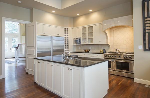 100 Westcliff Road Weston, MA 02493 - Photo 13 of 42 a kitchen with stainless steel appliances granite countertop a sink a stove and a refrigerator