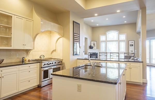 100 Westcliff Road Weston, MA 02493 - Photo 14 of 42 a kitchen with stainless steel appliances granite countertop a sink stove and cabinets