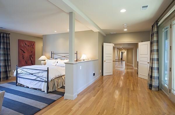 100 Westcliff Road Weston, MA 02493 - Photo 21 of 42 a spacious bedroom with a bed and wooden floor