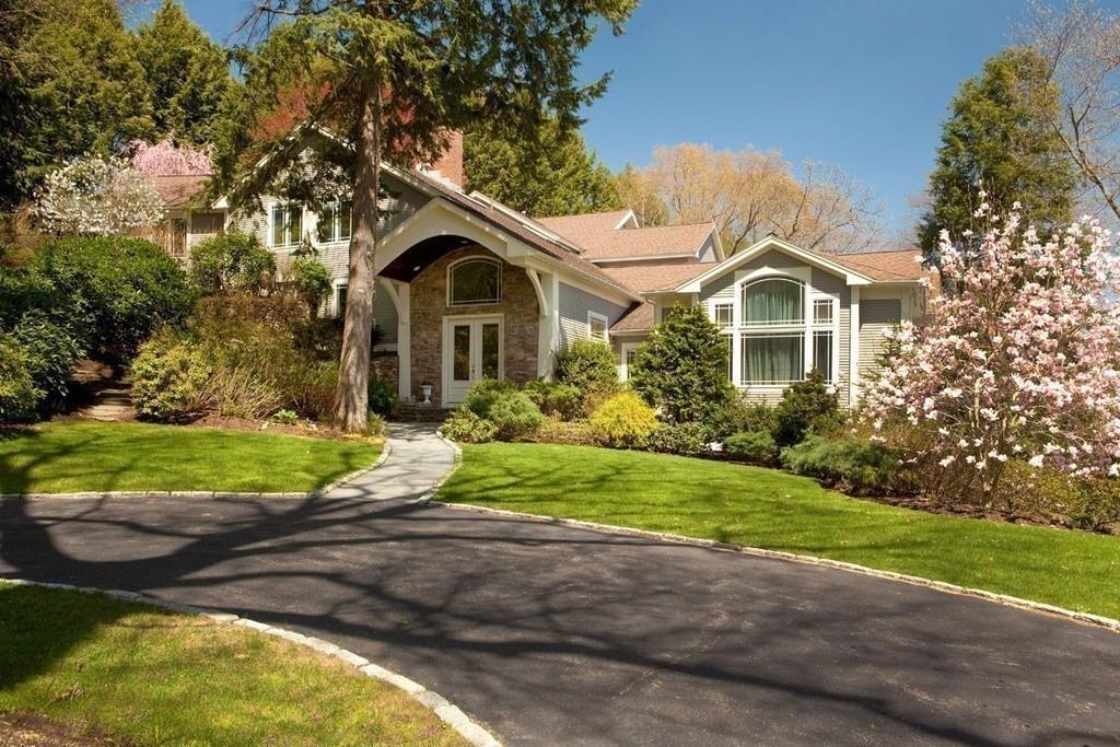 100 Westcliff Road Weston, MA 02493 - Photo 31 of 42 a front view of a house with a yard