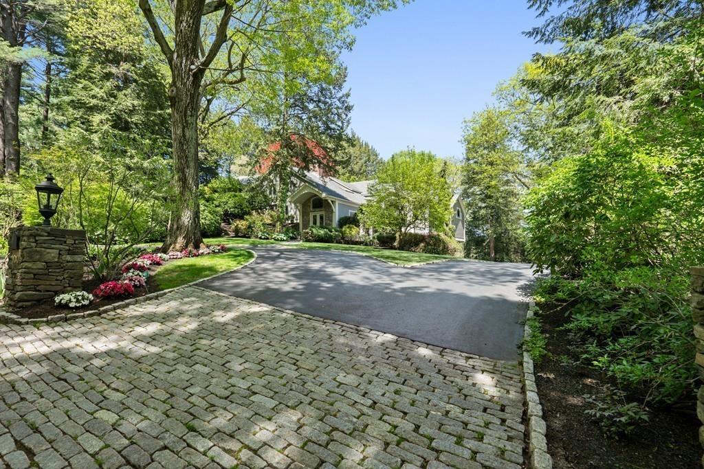 100 Westcliff Road Weston, MA 02493 - Photo 5 of 42 a view of a road with trees and cars