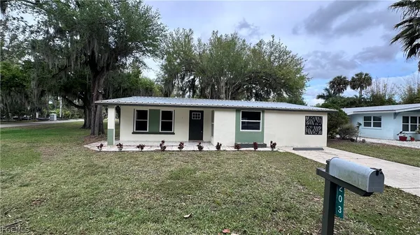 a front view of house with yard and seating area