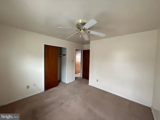 a bathroom with a shower and a toilet