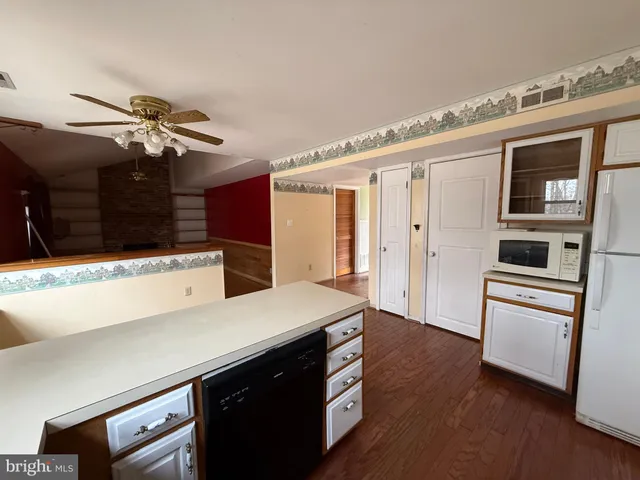 a kitchen with stainless steel appliances a sink stove and a refrigerator