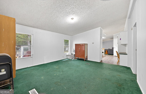 1090 South Hampton Road Hampton, GA 30228 - Photo 13 of 21 a view of a livingroom with a workspace