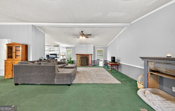 1090 South Hampton Road Hampton, GA 30228 - Photo 4 of 21 a living room with furniture and a fireplace