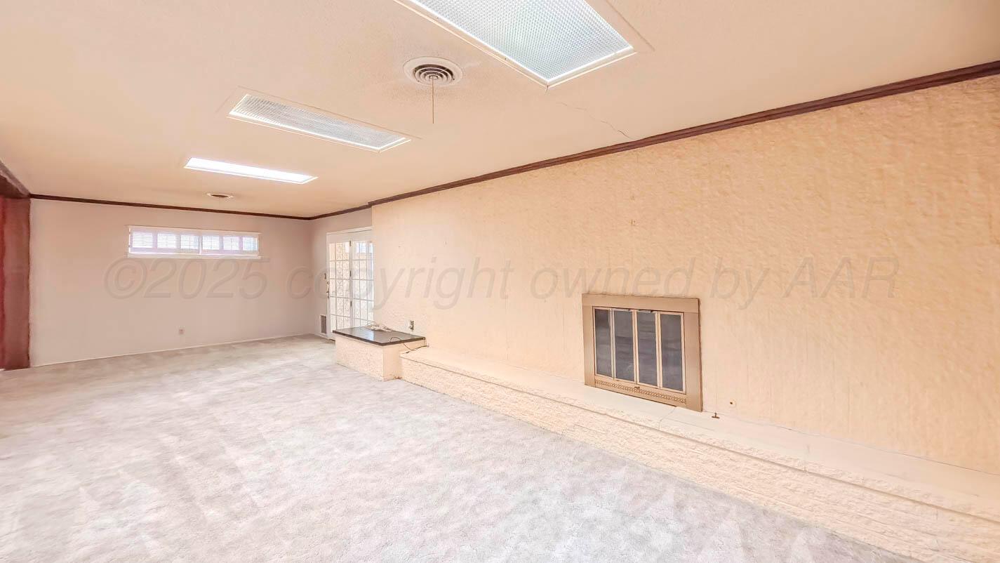 5015 Southwest 53rd Avenue Amarillo, TX 79109 - Photo 12 of 26 an empty room with windows