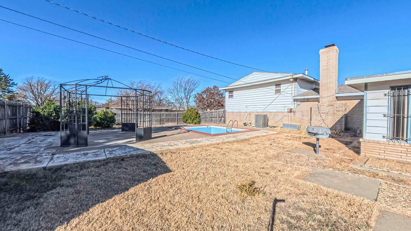 5015 Southwest 53rd Avenue Amarillo, TX 79109 - Photo 21 of 26 a house view with a backyard space