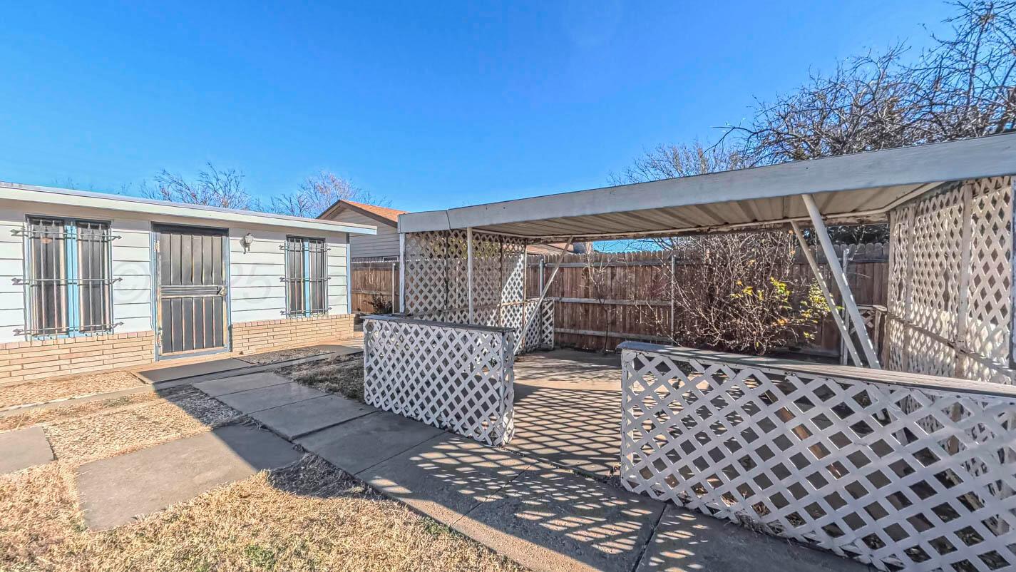5015 Southwest 53rd Avenue Amarillo, TX 79109 - Photo 22 of 26 a view of a patio with wooden fence