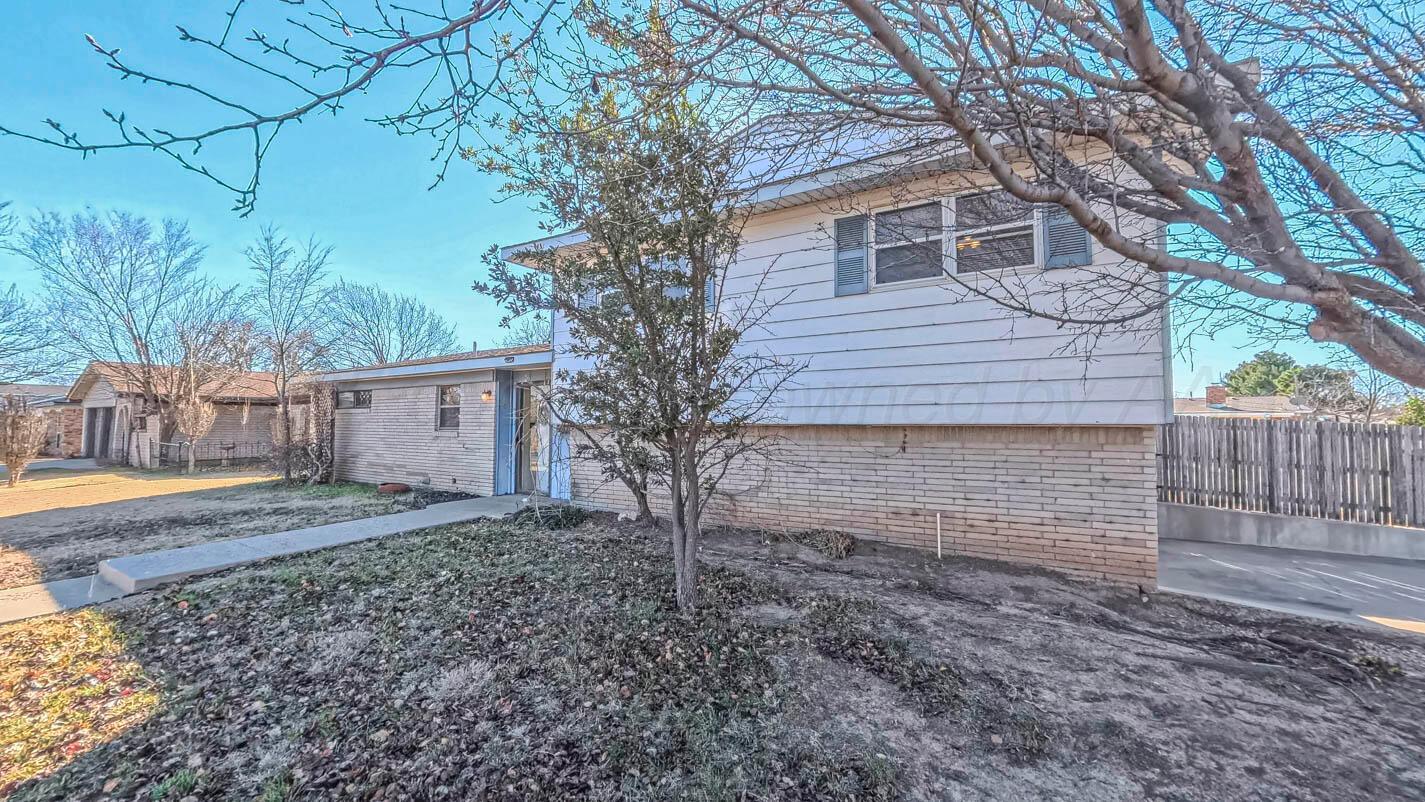 5015 Southwest 53rd Avenue Amarillo, TX 79109 - Photo 4 of 26 a view of a house with a yard