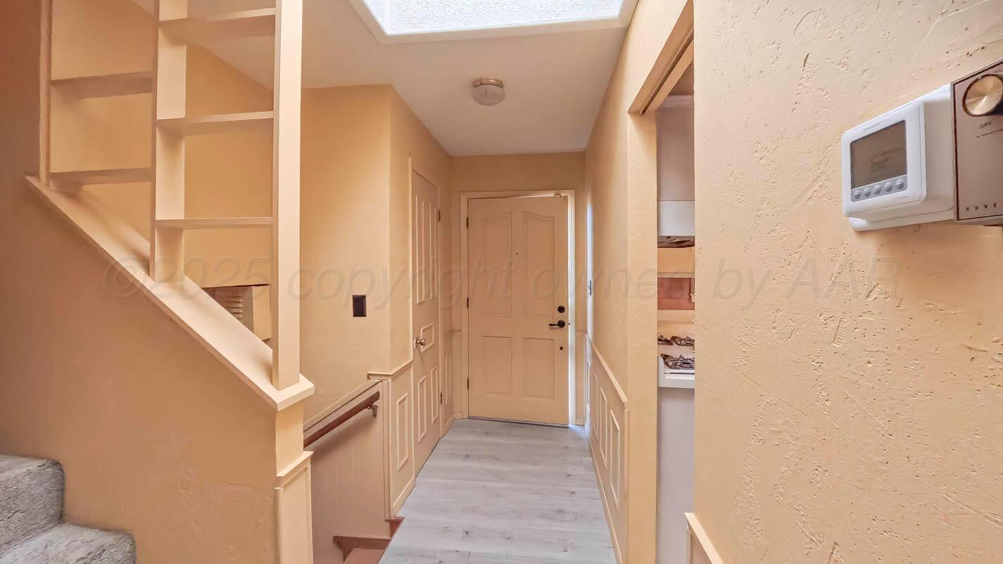 5015 Southwest 53rd Avenue Amarillo, TX 79109 - Photo 5 of 26 a view of a hallway with staircase