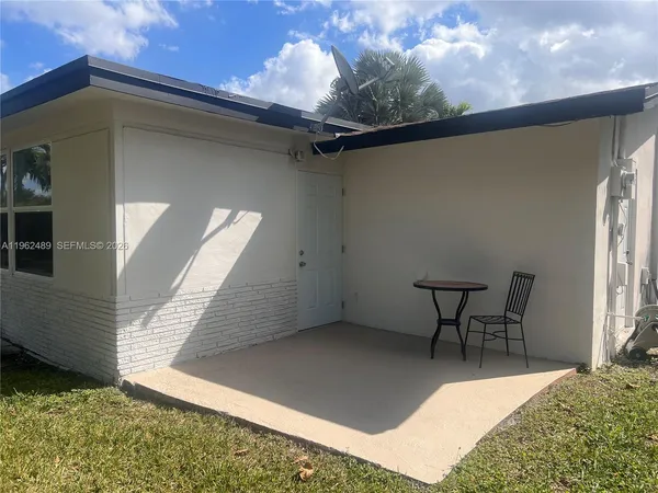 a view of balcony with furniture