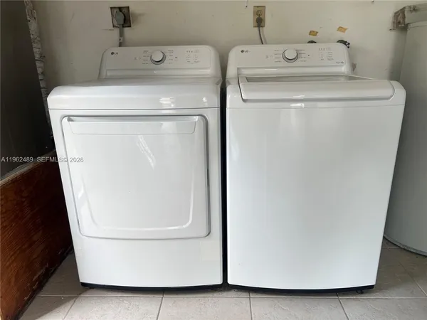 a utility room with dryer and washer
