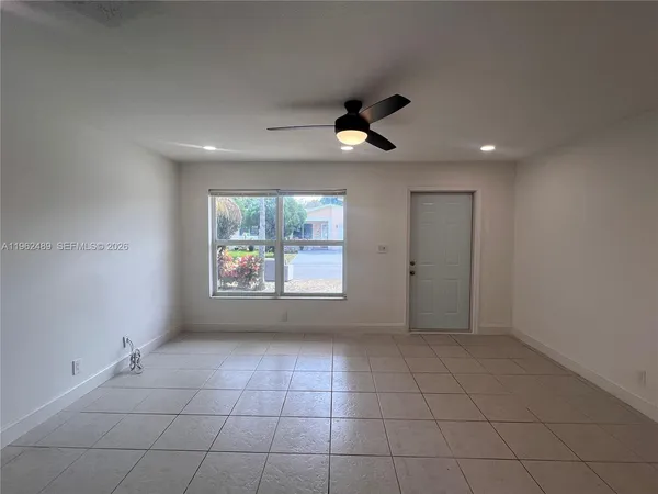 a view of an empty room with a window