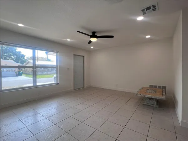 a view of an empty room with a window