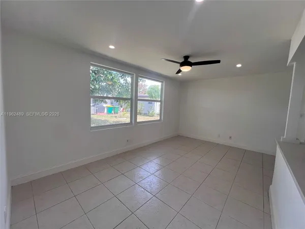 a view of an empty room with a window