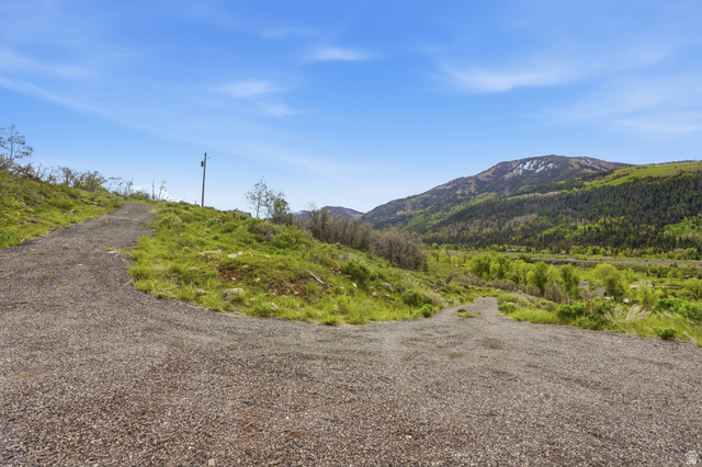 6 Beaver Springs Rancheros Oakley, UT 84055 - Photo 65 of 68 Gravel road surrounded by natural landscaping, offering views of distant mountains and lush green valleys