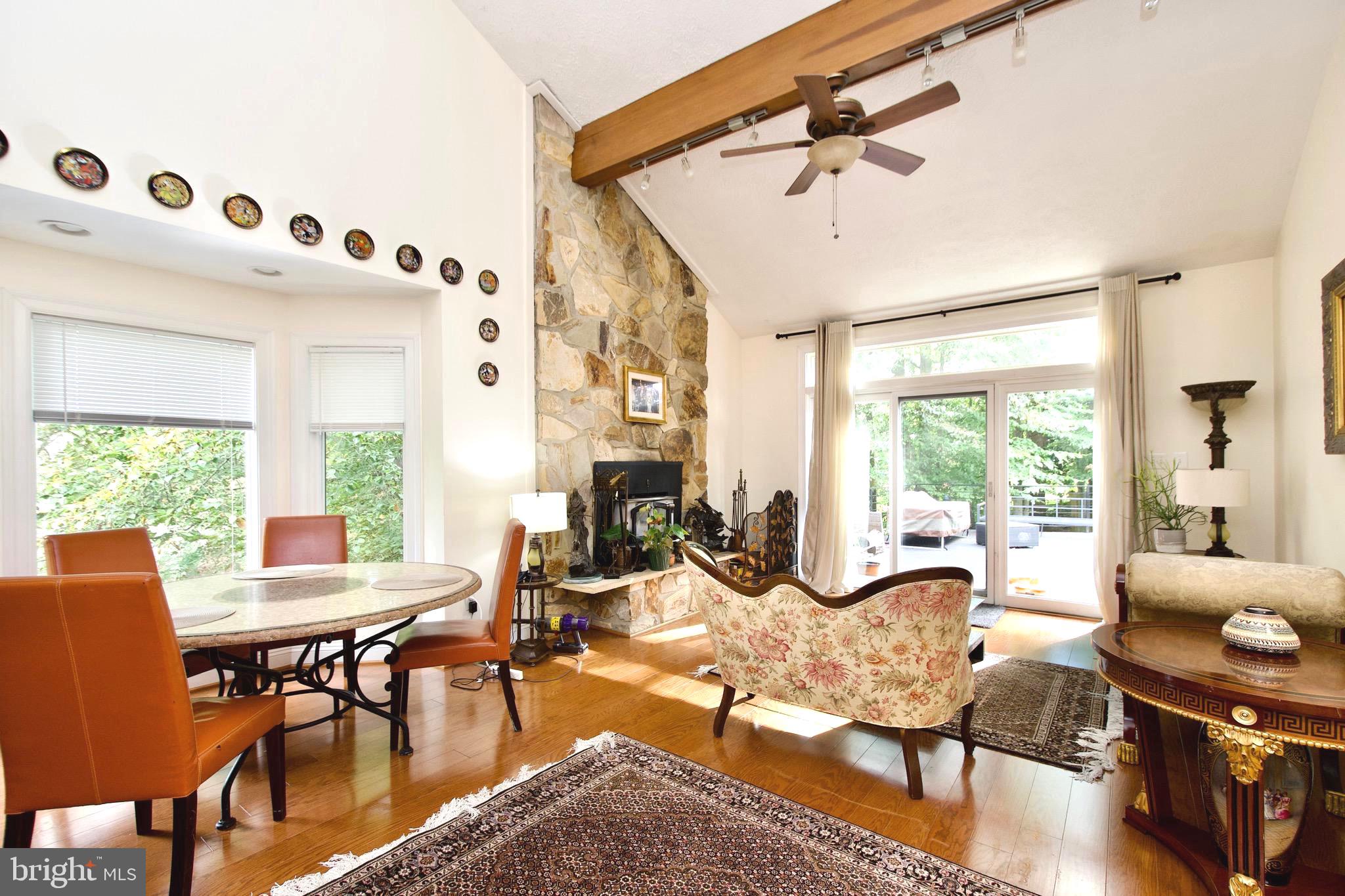 8312 Upper Spring Lane Annandale, VA 22003 - Photo 11 of 56 a living room with furniture and a large window