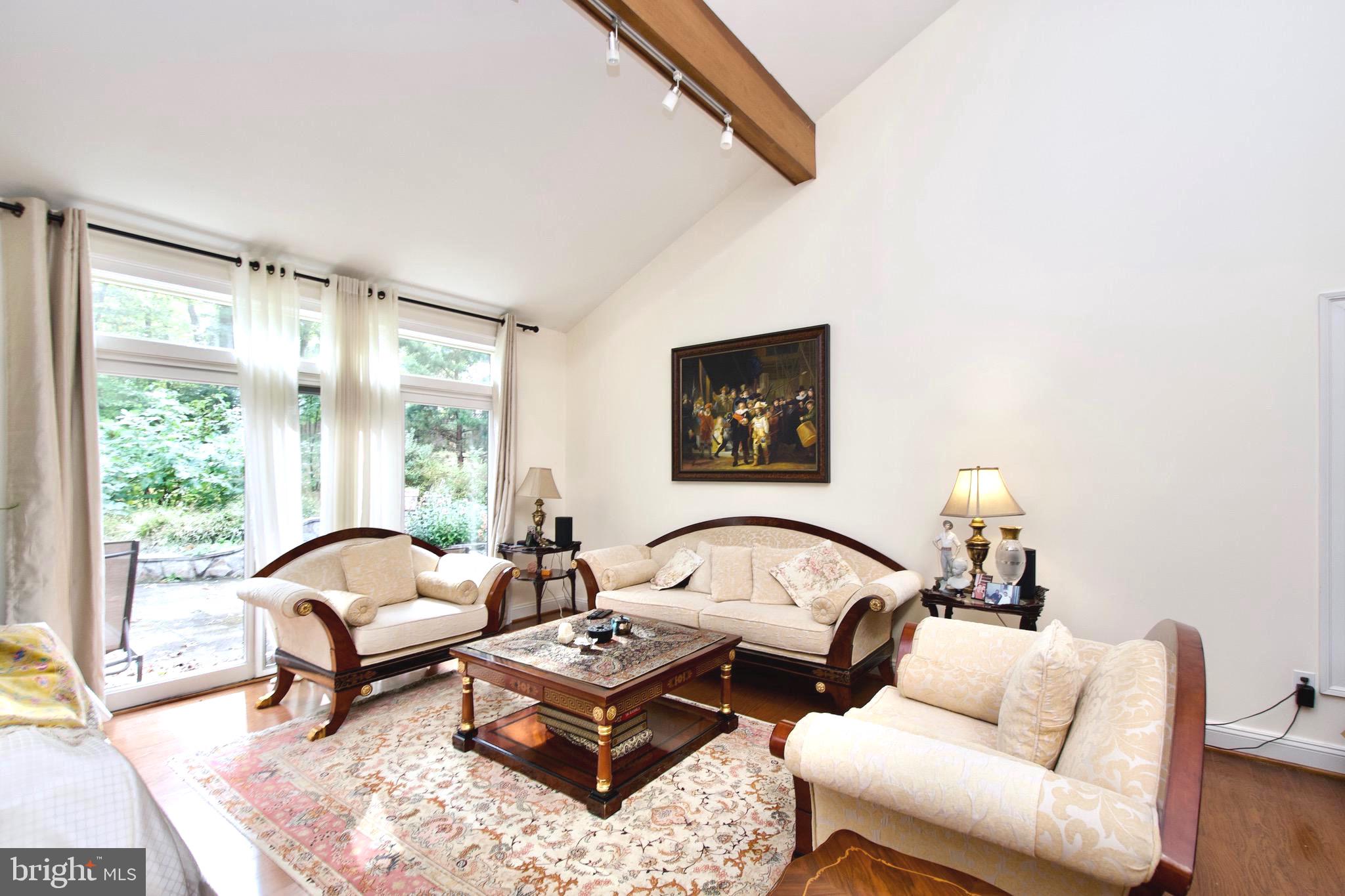 8312 Upper Spring Lane Annandale, VA 22003 - Photo 12 of 56 a living room with furniture and a window