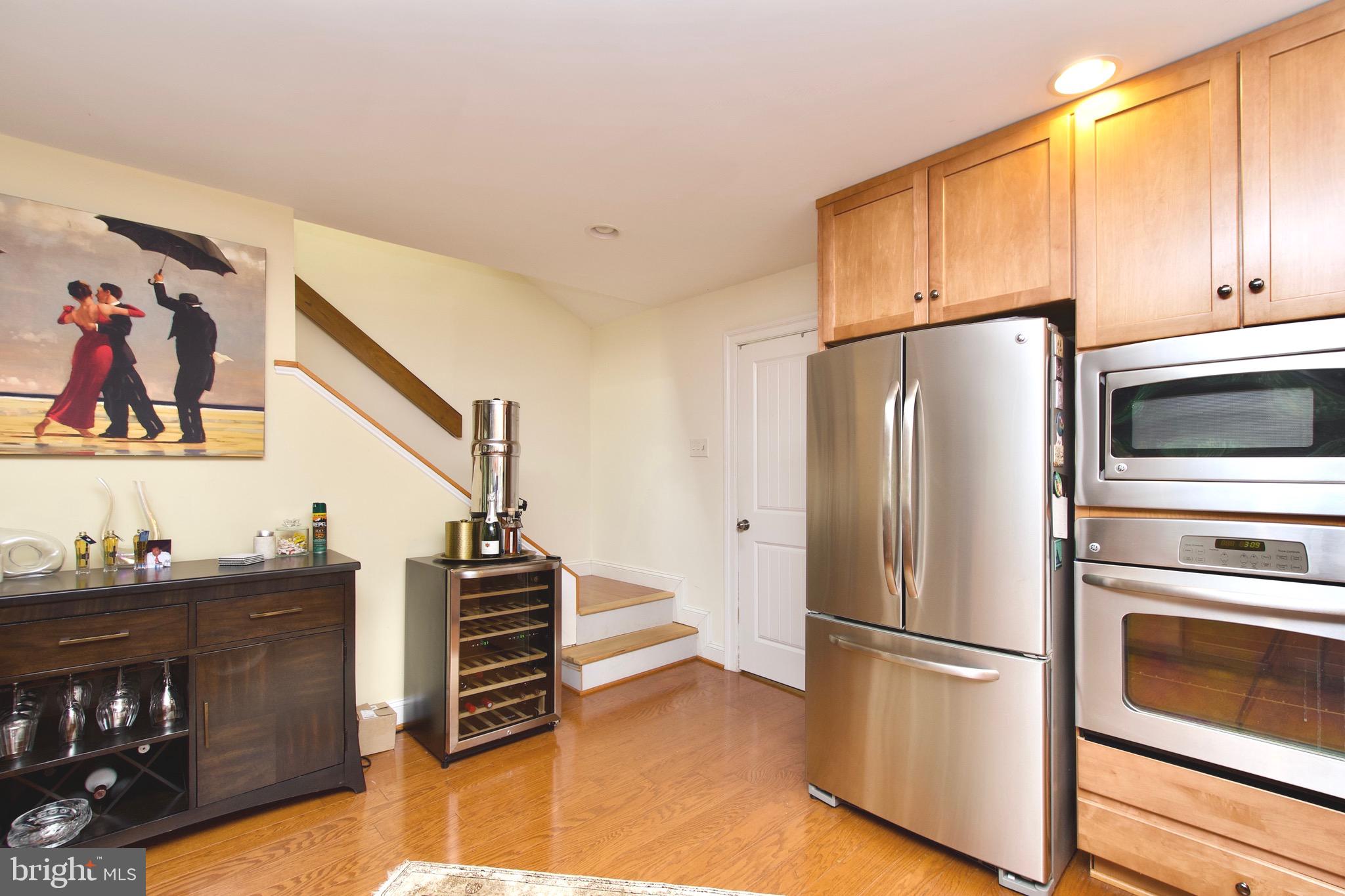 8312 Upper Spring Lane Annandale, VA 22003 - Photo 16 of 56 a kitchen with stainless steel appliances a refrigerator and cabinets